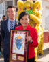 U.S. Postal Service Commemorates Lunar New Year with Year of the Rat Forever Stamp. Luke Grossmann, Senior Vice President, finance and strategy, U.S. Postal Service presents framed stamp art to Congresswoman Judy Chu.